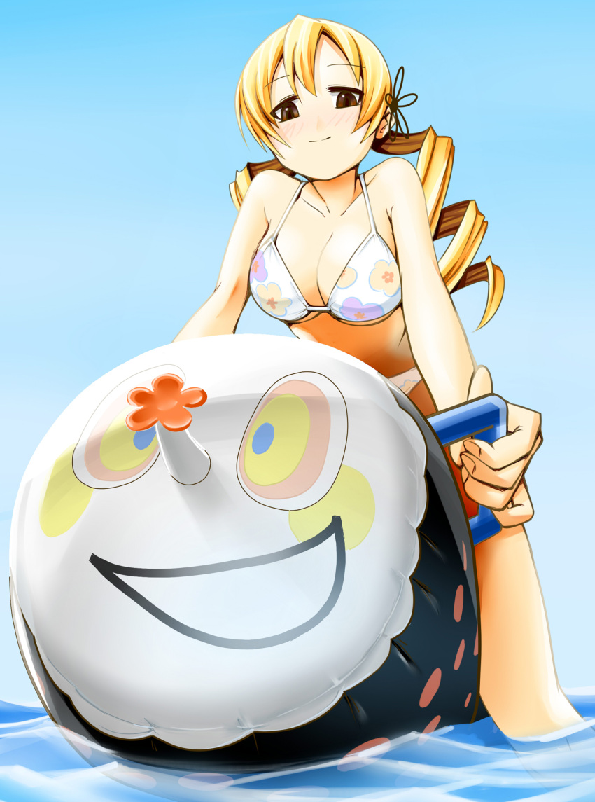 akitika bikini blonde_hair breasts brown_eyes charlotte_(madoka_magica) cleavage drill_hair floral_print hair_ornament highres inflatable_toy large_breasts long_hair looking_down mahou_shoujo_madoka_magica no_nose print_bikini smile solo straddle swimsuit tomoe_mami twin_drills underboob water yellow_eyes