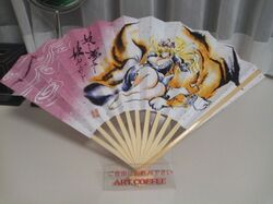  1girl animal_ears azuki_osamitsu bare_legs barefoot blonde_hair bracelet breasts cleavage closed_eyes dress eyes_closed fan fox fox_ears fox_tail gap huge_breasts jewelry kitsune long_hair multiple_tails photo sleeping tail touhou translation_request yakumo_ran yakumo_ran_(fox) yakumo_yukari 