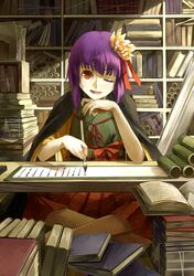  1girl book book_stack brush desk flower hair_flower hair_ornament hieda_no_akyuu highres indian_style nishiuri purple_hair red_eyes scroll shelf short_hair sitting smile solo touhou wink writing 