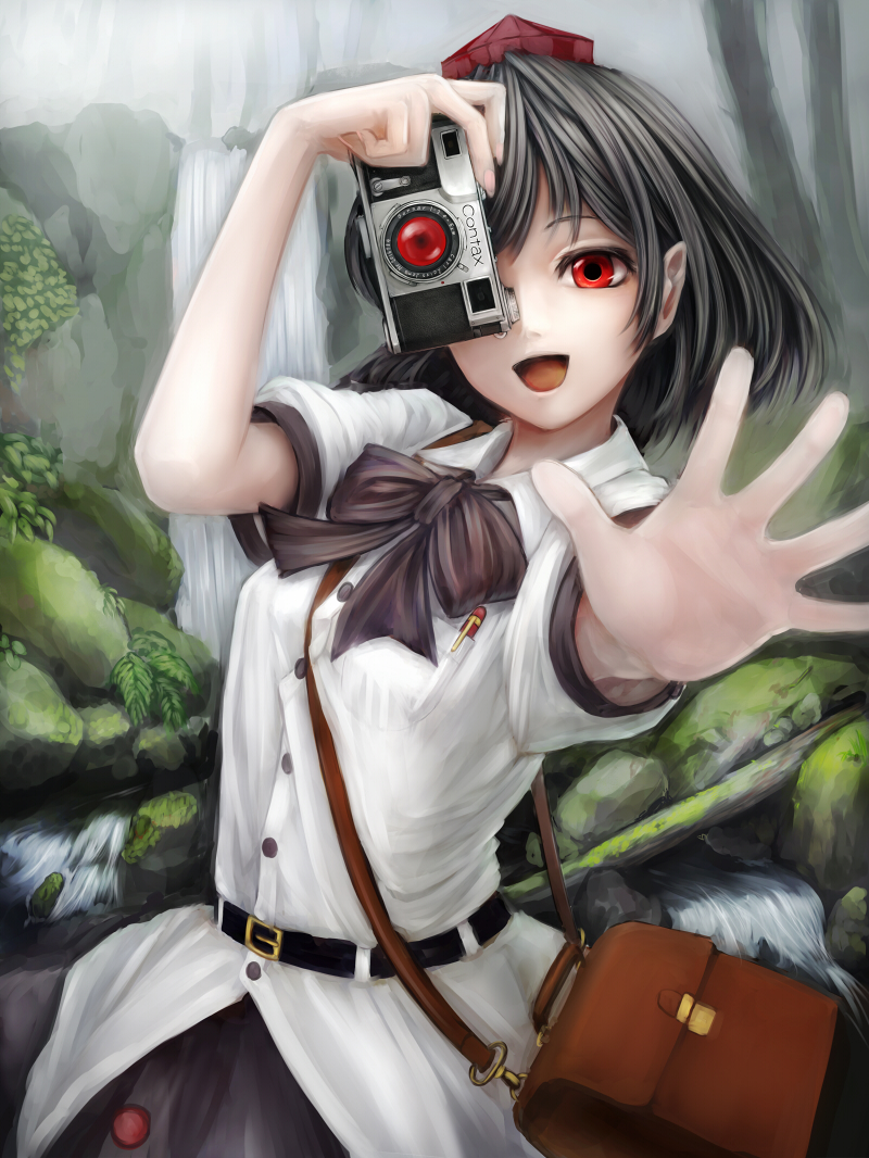 1girl bag belt black_hair bow camera hat looking_at_viewer nishi_masakazu open_mouth outstretched_arm outstretched_hand pen red_eyes river shameimaru_aya shirt short_sleeves shoulder_bag skirt smile solo tokin_hat touhou water waterfall