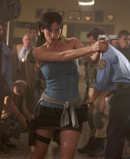 brown_hair capcom gun holster jill_valentine live_action movie office pistol police resident_evil satchel screen_gems short_hair skirt tubetop