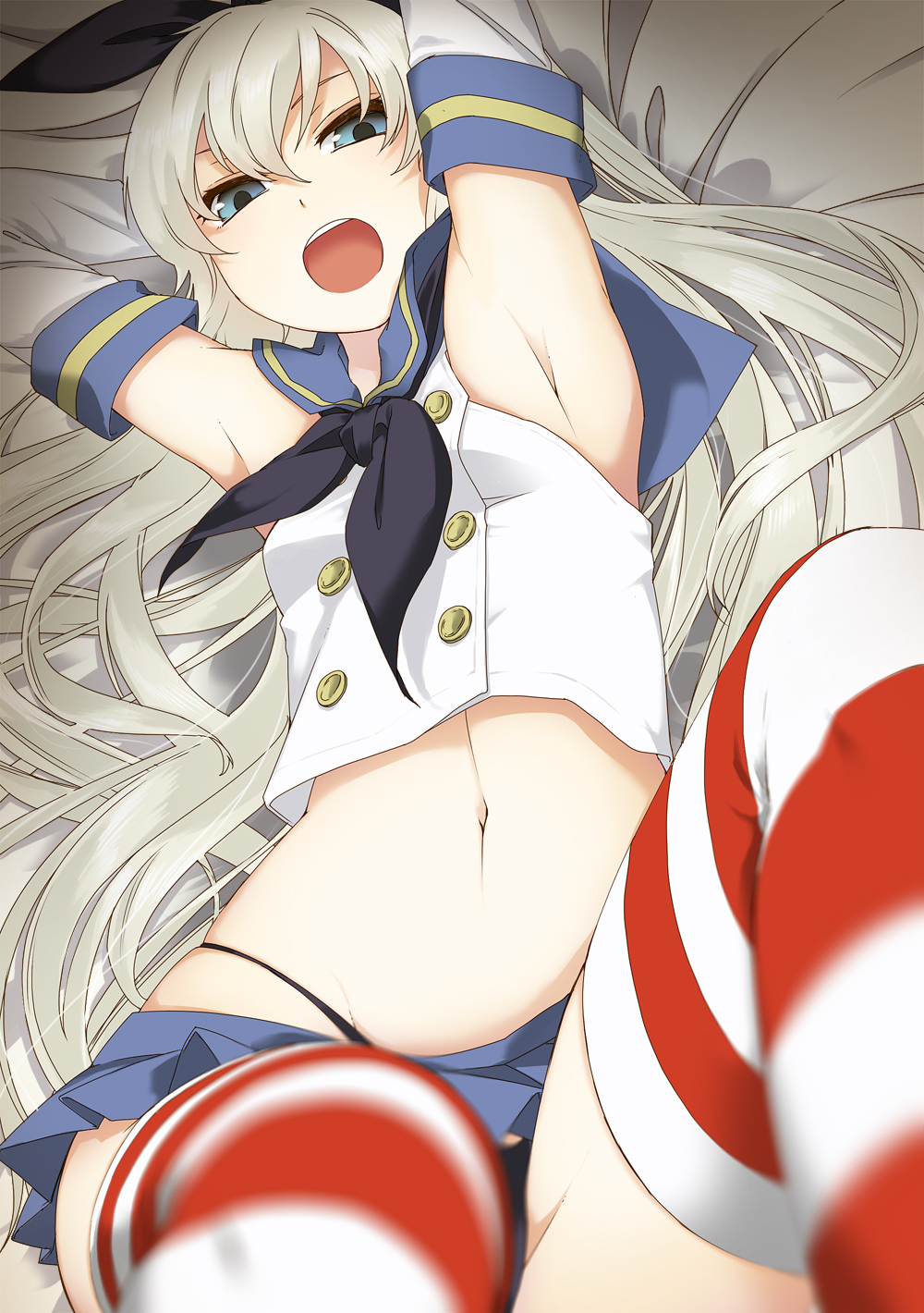 1girl armpits arms_behind_head bed_sheet black_panties blonde_hair blue_eyes blurry chito04 hairband highres kantai_collection long_hair navel open_mouth panties personification shimakaze_(kantai_collection) skirt solo striped striped_legwear thighhighs underwear