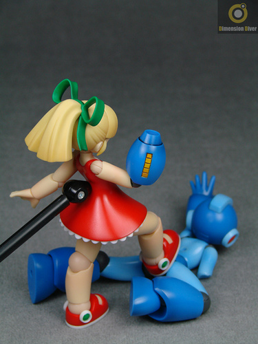 dimension_diver doll_joints dress femdom figure hair_ribbon lowres photo ponytail ribbon rockman rockman_(character) rockman_(classic) roll stomp watermark