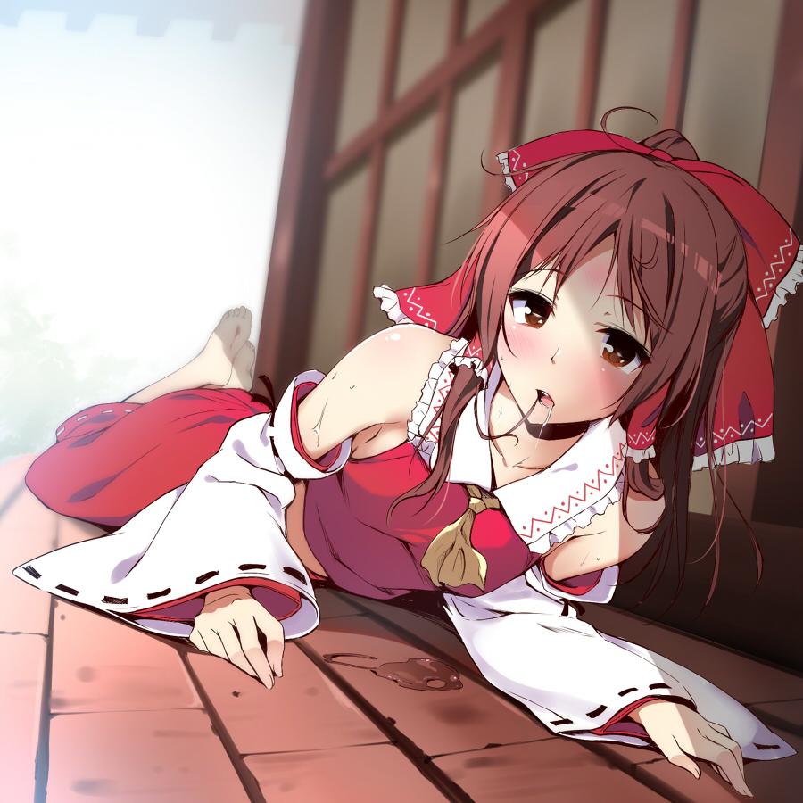 1girl ascot bare_shoulders barefoot blush bow brown_eyes brown_hair collarbone detached_sleeves drooling hair_bow hair_in_mouth hair_tubes hakurei_reimu japanese_clothes long_hair looking_at_viewer lying miko nironiro on_stomach ribbon-trimmed_sleeves ribbon_trim saliva solo touhou