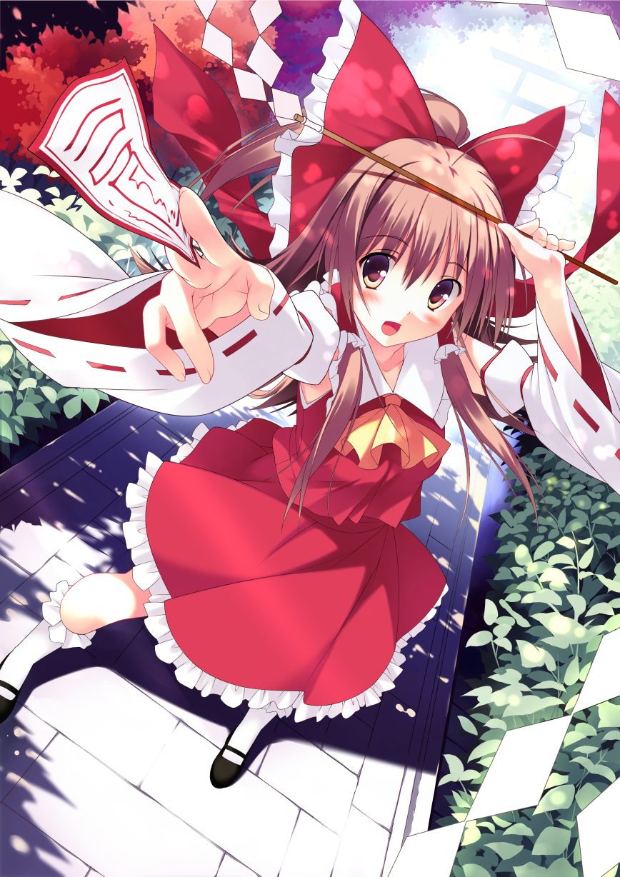 1girl arm_up ascot blush brown_eyes brown_hair detached_sleeves dutch_angle from_above full_body gohei hair_ribbon hair_tubes hakurei_reimu highres kneehighs long_hair long_sleeves mary_janes mushroom_(artist) ofuda open_mouth outstretched_arm ribbon shirt shoes skirt skirt_set smile solo torii touhou tree_shade white_legwear wide_sleeves