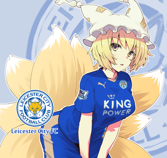 1girl blonde_hair fox_tail fujii_jun hat leicester_city_fc looking_at_viewer multiple_tails short_hair soccer_uniform solo sportswear tail touhou yakumo_ran yellow_eyes