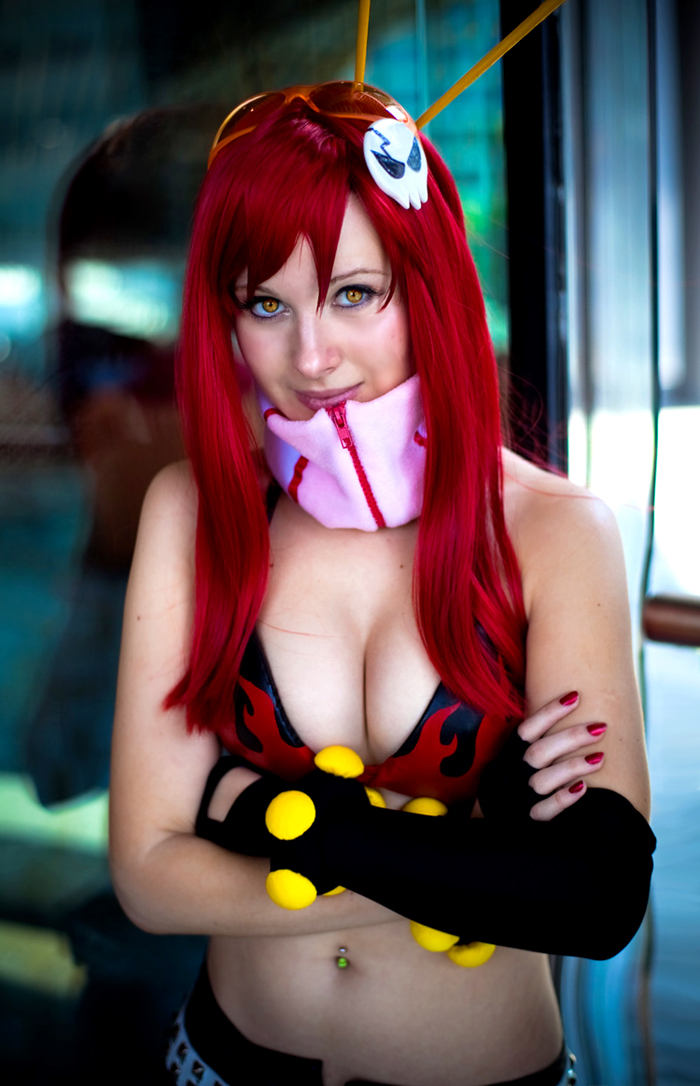 bikini_top breasts cleavage cosplay elbow_gloves fingerless_gloves gloves mortelle navel_piercing photo piercing red_hair redhead smile solo studded_belt tengen_toppa_gurren_lagann yellow_eyes yoko_littner yoko_ritona