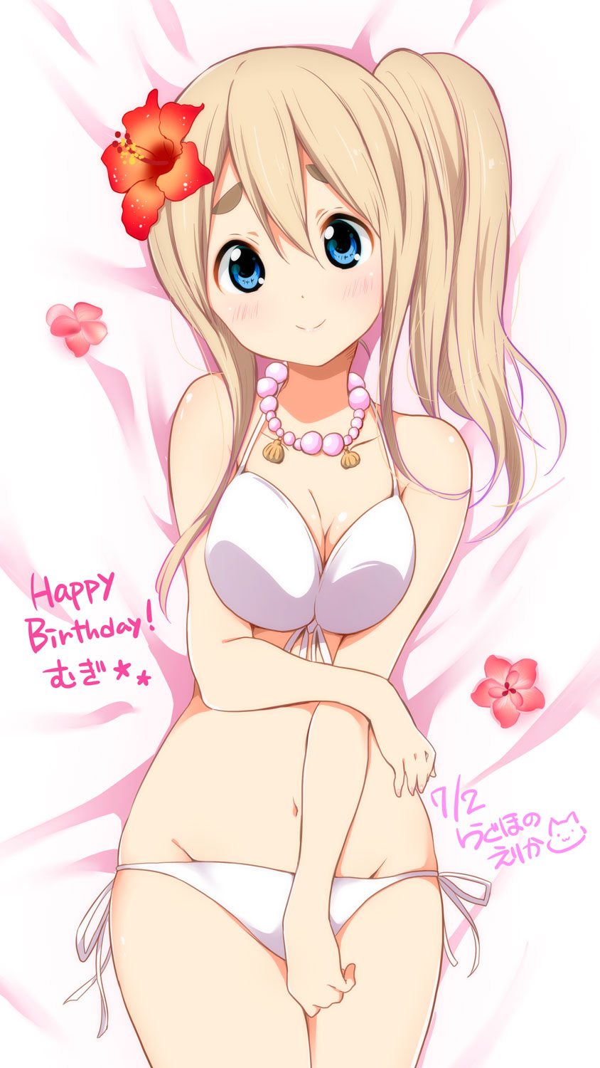 1girl bed_sheet bikini blonde_hair blue_eyes blush breast_squeeze breasts character_name cleavage dated eyebrows flower groin hair_flower hair_ornament happy_birthday hibiscus highres jewelry k-on! kotobuki_tsumugi looking_at_viewer lying navel necklace on_back pearl_necklace ragho_no_erika side_ponytail signature smile solo swimsuit thick_eyebrows white_bikini