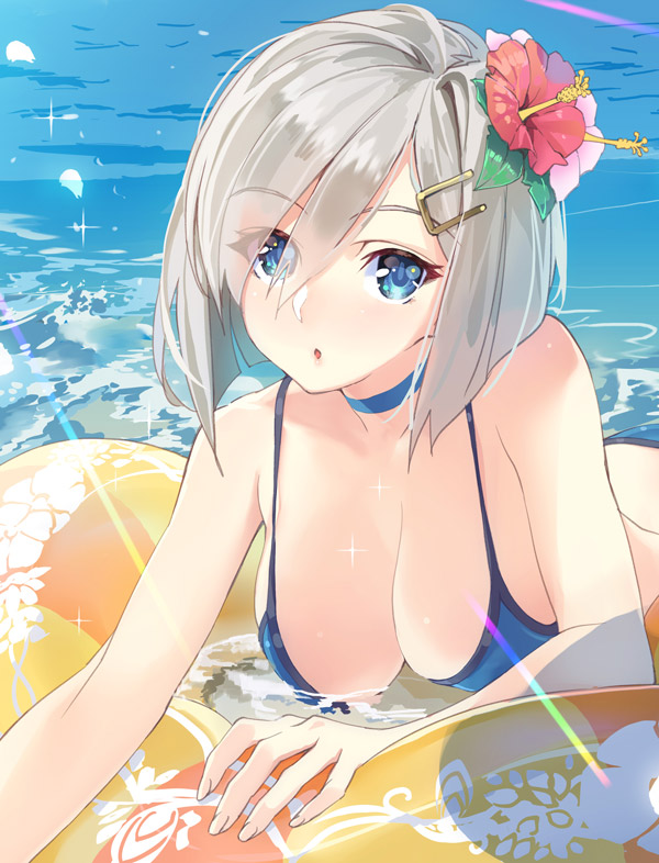 1girl :o bare_arms bare_shoulders bikini blue_bikini blue_eyes blush breasts choker cleavage collarbone day eyebrows eyebrows_visible_through_hair flower hair_flower hair_ornament hair_over_one_eye hairclip hamakaze_(kantai_collection) hanging_breasts head_tilt hibiscus innertube kantai_collection large_breasts light_rays ocean parted_lips short_hair silver_hair solo swimsuit water yahako