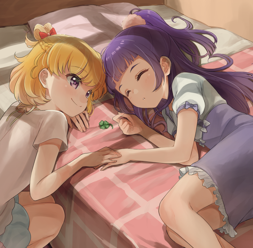 2girls asahina_mirai blonde_hair clover four-leaf_clover gobou_1000 hand_on_another's_hand heart heart-shaped_pupils holding_hands izayoi_liko long_hair looking_at_another lying mahou_girls_precure! multiple_girls on_side precure purple_hair sleeping smile symbol-shaped_pupils yuri