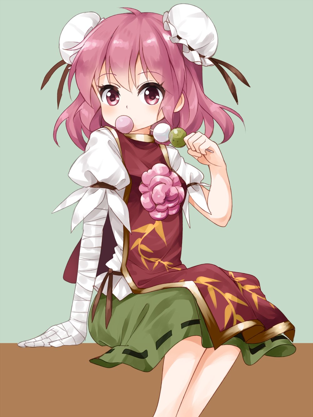 1girl arm_garter arm_support bandaged_arm blush bun_cover chains chinese_clothes cuffs dango double_bun eating flower food food_in_mouth green_skirt hair_bun highres ibaraki_kasen looking_at_viewer pink_eyes pink_hair pink_rose puffy_short_sleeves puffy_sleeves rose ruu_(tksymkw) shackles short_hair short_sleeves sitting skirt solo tabard touhou wagashi