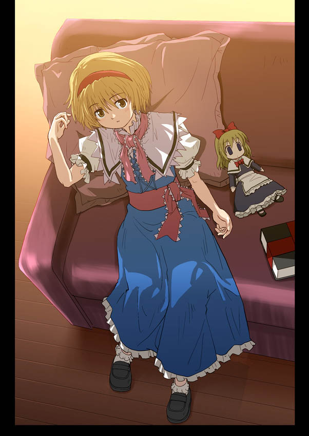 1girl alice_margatroid blonde_hair book brown_eyes capelet couch dress female from_above hairband haniwa haniwa_(leaf_garden) pillarboxed pillow shanghai_doll short_hair sitting solo touhou yellow_eyes