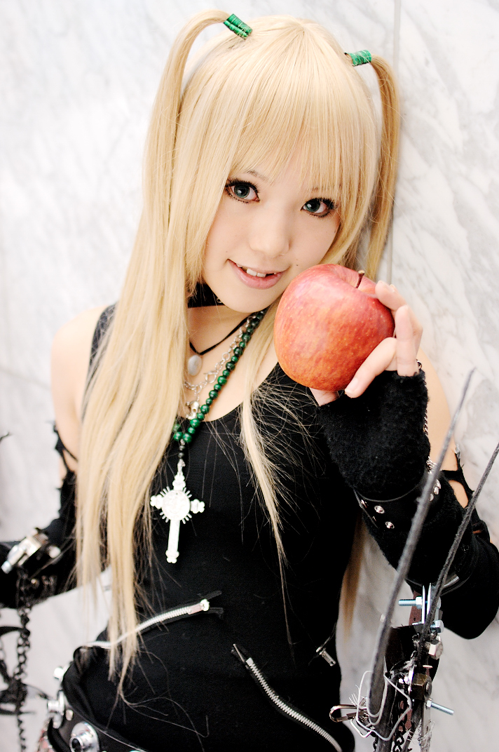 1girl amane_misa apple asian bangs belt blonde_hair cosplay cross_necklace death_note fingerless_gloves kipi-san looking_at_viewer photo real_life solo two_side_up