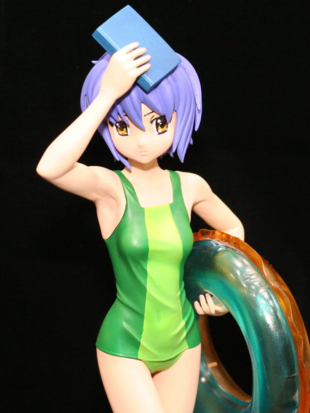 1girl arm_up armpits black_background book brown_eyes casual_one-piece_swimsuit figure green_swimsuit innertube looking_at_viewer nagato_yuki one-piece_swimsuit photo purple_hair short_hair simple_background solo suzumiya_haruhi_no_yuuutsu swimsuit wonder_festival wonder_festival_2007