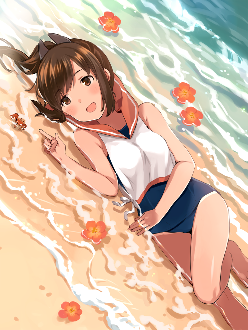 1girl :d bangs barefoot beach blush brown_eyes brown_hair crab crop_top day flower hair_ornament hibiscus i-401_(kantai_collection) index_finger_raised kantai_collection lying on_side one-piece_swimsuit open_mouth outdoors pointing ponytail sand school_uniform serafuku sleeveless smile solo swimsuit swimsuit_under_clothes tan tan_(tangent) tanline water
