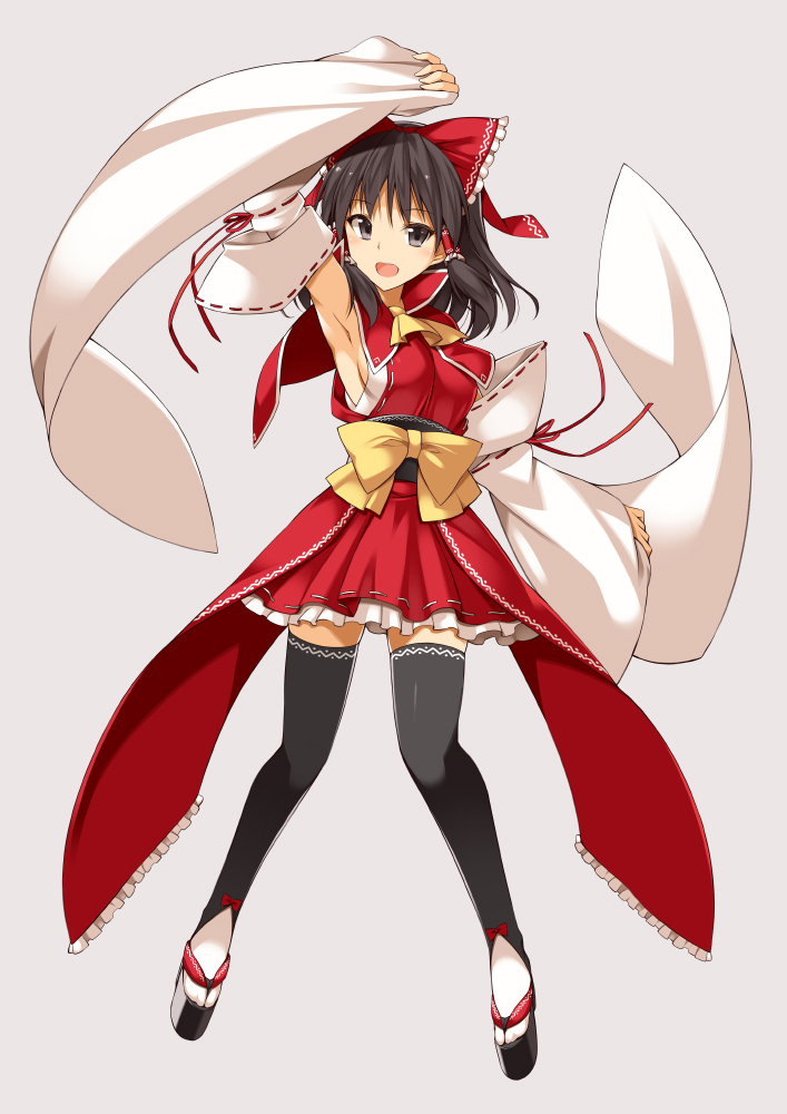 1girl :d arm_up armpits ascot bare_shoulders black_eyes black_hair black_legwear bow breasts commentary_request detached_sleeves embellished_costume frilled_bow frilled_skirt frills full_body geta grey_background hair_bow hair_tubes hakurei_reimu legs_apart long_hair long_sleeves looking_at_viewer medium_breasts oota_yuuichi open_mouth ponytail red_bow red_ribbon red_skirt red_vest ribbon ribbon-trimmed_sleeves ribbon_trim sash sideboob sidelocks simple_background skirt sleeveless smile solo standing thigh-highs touhou vest wide_sleeves yellow_bow zettai_ryouiki