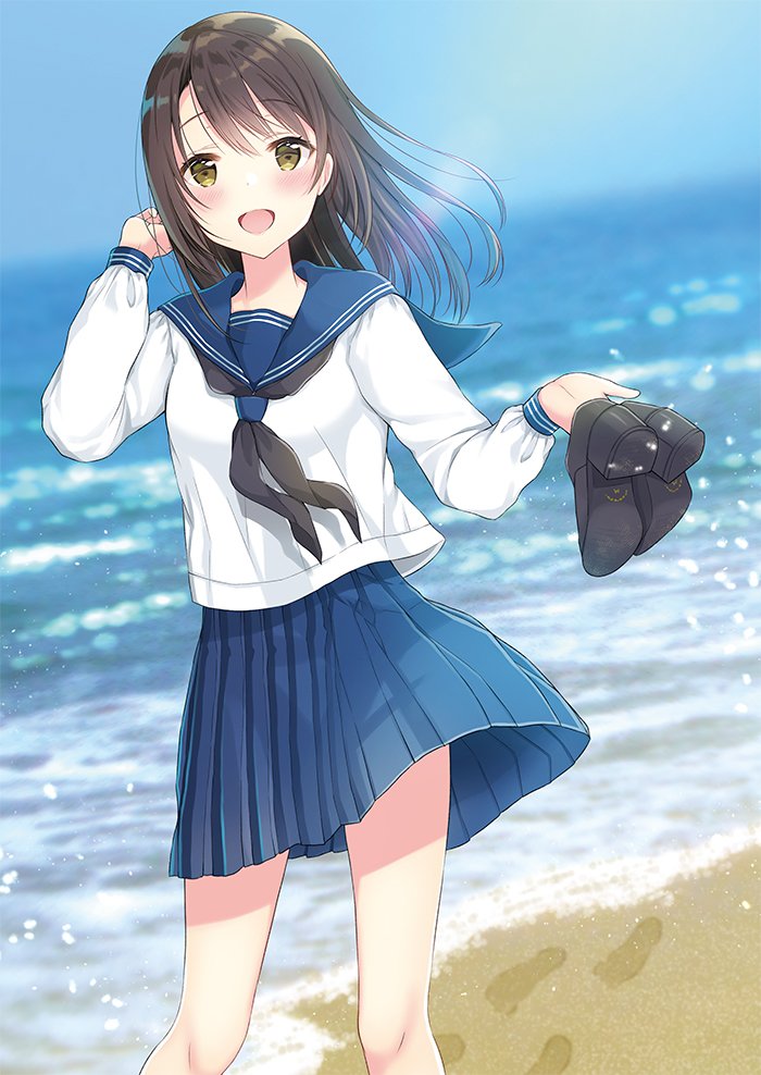 1girl :d bangs beach black_neckerchief black_shoes blue_skirt blurry blush brown_eyes brown_hair day depth_of_field eyebrows_visible_through_hair footprints hand_up holding holding_shoes legs_apart long_hair long_sleeves looking_at_viewer neckerchief ocean open_mouth original outdoors pleated_skirt school_uniform serafuku shoes shoes_removed skirt smile solo standing ueno_tomo