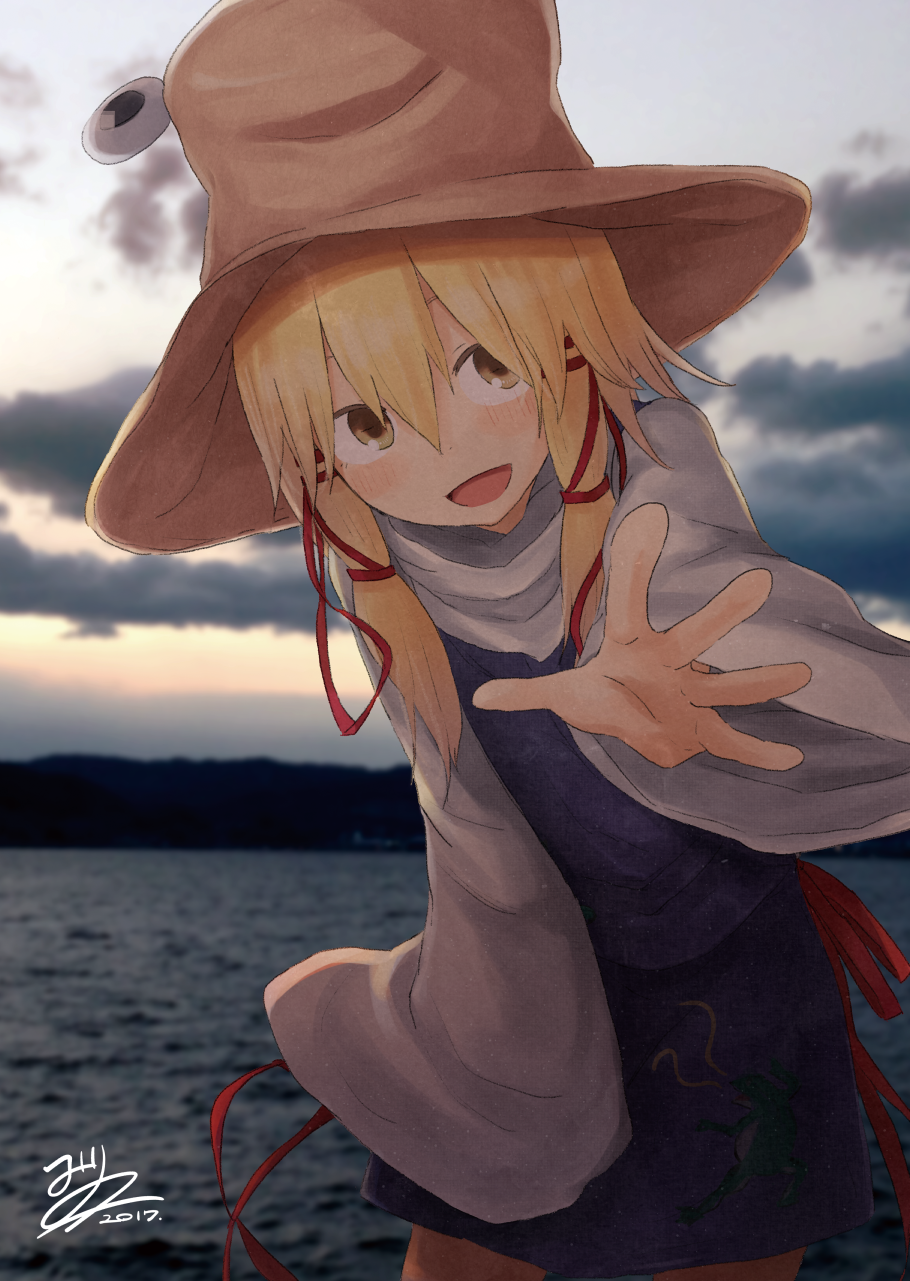 1girl blonde_hair breasts clouds cloudy_sky hair_between_eyes hair_ribbon hat highres long_sleeves looking_at_viewer mirino moriya_suwako outdoors photo_background purple_skirt reaching_out red_ribbon ribbon skirt skirt_set sky smile solo touhou tress_ribbon vest water wide_sleeves yellow_eyes