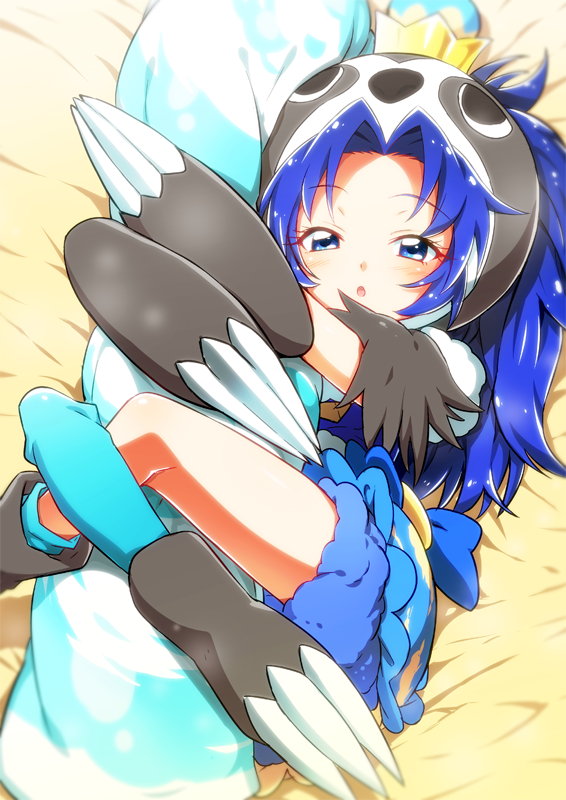 1girl :o animal_costume bed_sheet blue_dress blue_eyes blue_hair blue_legwear blue_shorts claws commentary_request crown cure_gelato dress eyebrows_visible_through_hair from_above half-closed_eyes kirakira_precure_a_la_mode leg_lock long_hair looking_at_viewer lying mini_crown object_hug on_back precure shiny shiny_hair shorts sloth_costume solo tategami_aoi yuto_(dialique)