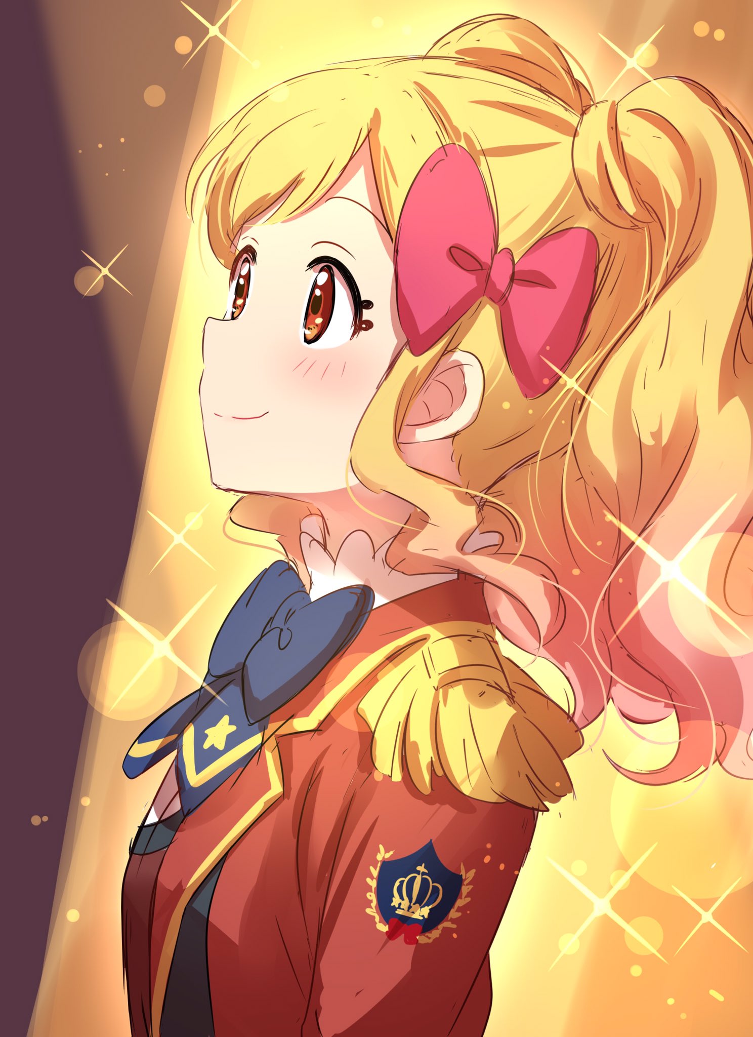 1girl aikatsu! badge blonde_hair blue_neckwear blush bow bowtie brown_eyes closed_mouth epaulettes eyelashes from_side gradient_hair hair_bow highres jacket lens_flare long_sleeves looking_up multicolored_hair nijino_yume pink_bow pink_hair red_jacket sekina smile solo sparkle spotlight twintails upper_body