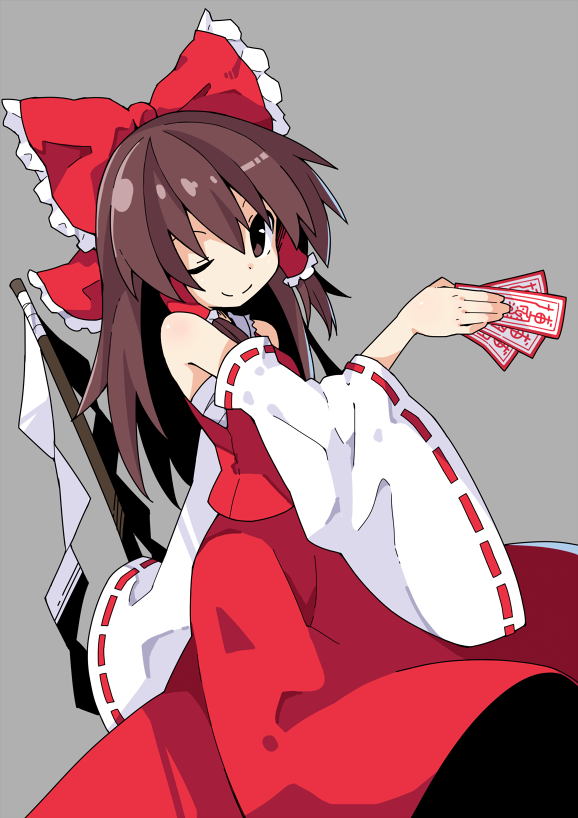 1girl ;) asameshi bangs bow brown_eyes brown_hair closed_mouth cowboy_shot detached_sleeves gohei grey_background hair_bow hair_tubes hakurei_reimu holding long_hair long_sleeves looking_at_viewer ofuda one_eye_closed red_bow red_skirt ribbon-trimmed_sleeves ribbon_trim sarashi sidelocks simple_background skirt skirt_set smile solo touhou wide_sleeves