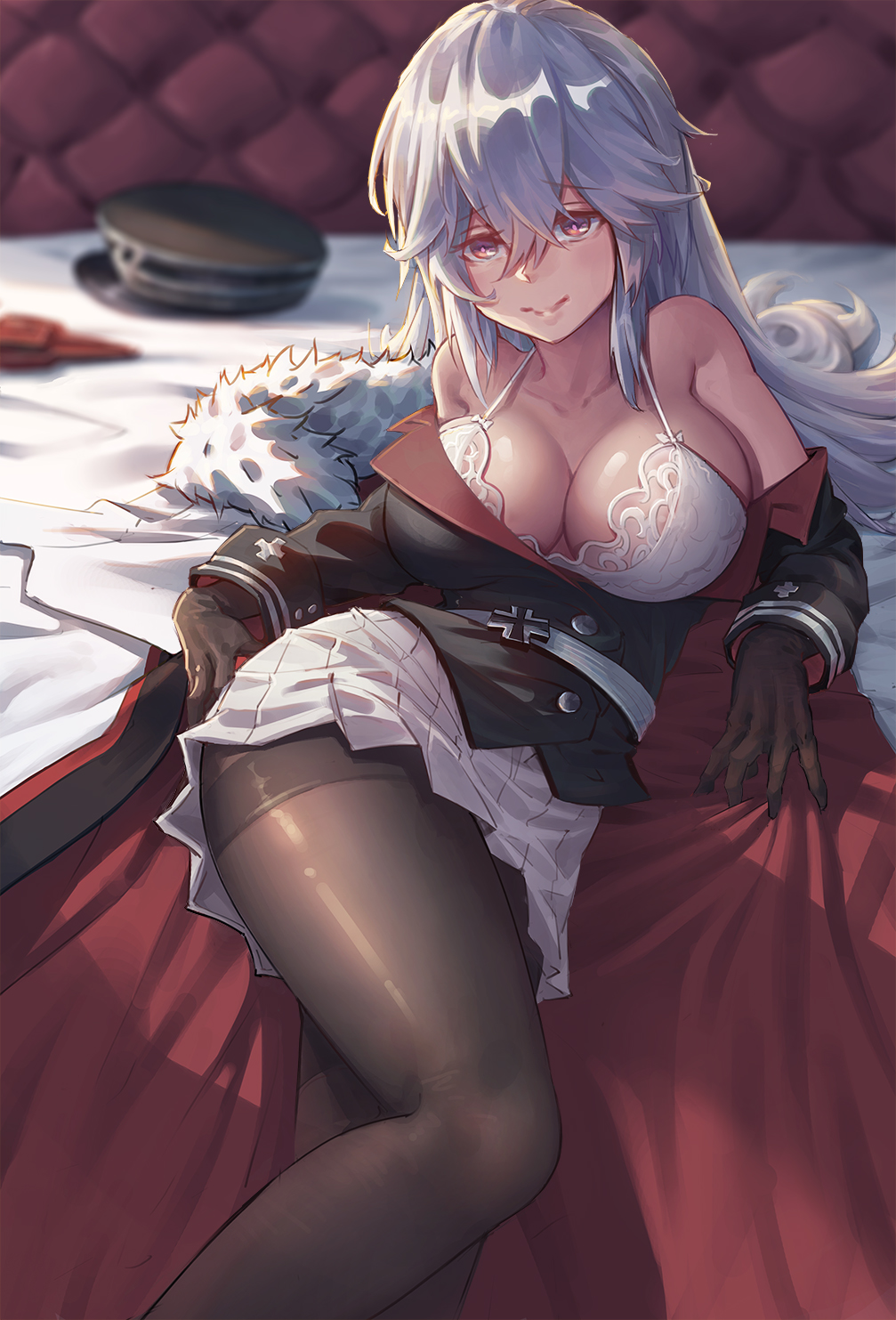 1girl armpit_crease azur_lane bed_sheet belt black_gloves black_jacket black_legwear blurry bra breasts cape cleavage collarbone crossed_bangs depth_of_field double-breasted eyebrows_visible_through_hair fur-trimmed_cape fur_trim gloves graf_zeppelin_(azur_lane) hair_between_eyes hat hat_removed headwear_removed highres iron_cross jacket lace lace-trimmed_bra large_breasts long_hair looking_at_viewer lying military military_uniform off_shoulder on_bed pantyhose peaked_cap pleated_skirt red_eyes sidelocks silver_hair skirt sleeve_cuffs smile solo thighband_pantyhose underwear uniform white_skirt xian_yu_mo_ren