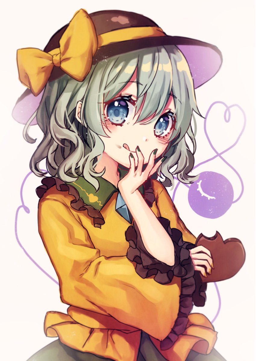 1girl bow commentary_request eyebrows_visible_through_hair food frilled_shirt_collar frills green_eyes green_hair green_nails green_skirt hair_between_eyes hat hat_bow head_tilt heart heart-shaped_food heart_of_string highres holding holding_chocolate holding_food komeiji_koishi kyouda_suzuka looking_at_viewer nail_polish shirt short_hair simple_background skirt smile solo third_eye tongue tongue_out touhou upper_body white_background yellow_bow yellow_shirt