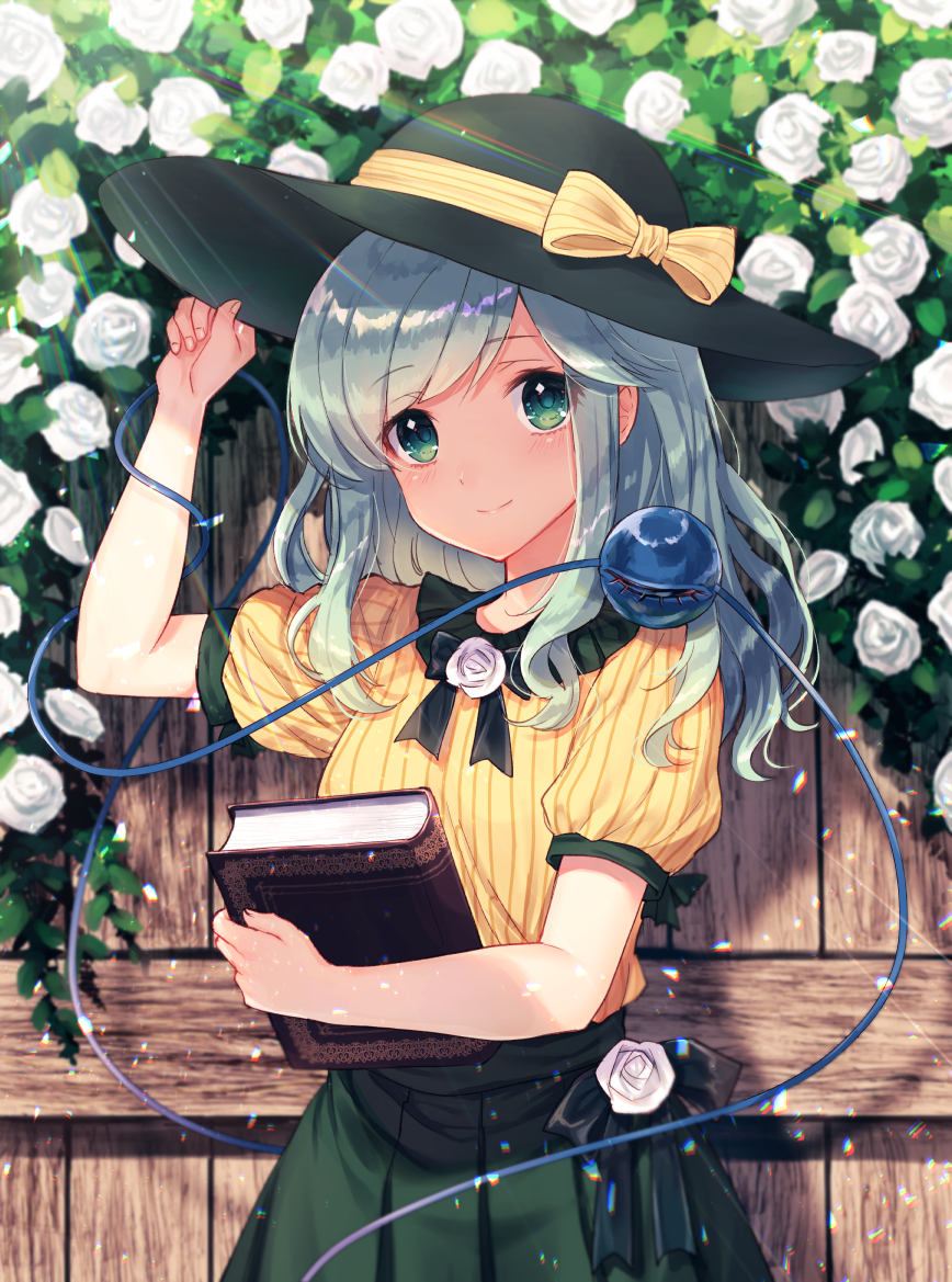 1girl adapted_costume arm_up black_bow black_hat black_neckwear blush book bow bowtie closed_mouth cowboy_shot day eyebrows_visible_through_hair fence fingernails flower green_eyes green_hair green_skirt hand_on_headwear hat hat_bow holding holding_book komeiji_koishi leaf light_particles light_rays lips long_hair looking_at_viewer nunucco outdoors puffy_short_sleeves puffy_sleeves rose rose_bush shiny shiny_hair shirt short_sleeves sidelocks skirt smile solo standing string striped striped_shirt sunbeam sunlight tareme third_eye touhou vertical-striped_shirt vertical_stripes white_flower white_rose wooden_fence yellow_bow yellow_shirt