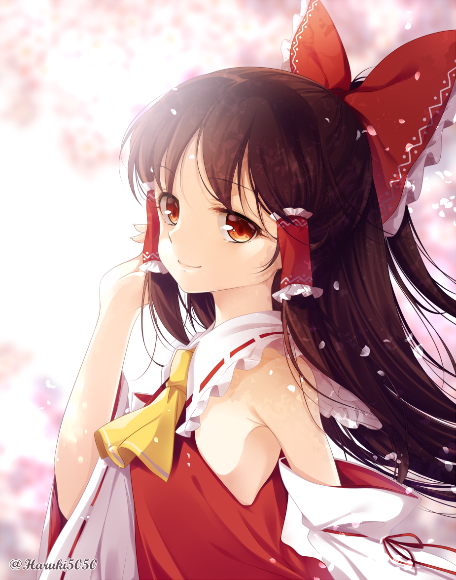 1girl ascot bangs bare_shoulders bow breasts brown_eyes brown_hair cherry_blossoms closed_mouth collared_shirt commentary_request detached_sleeves eyebrows_visible_through_hair eyelashes fingernails frilled_bow frilled_hair_tubes frilled_shirt_collar frills from_side hair_bow hair_tubes hakurei_reimu hand_up haruki_(colorful_macaron) long_hair looking_at_viewer no_bra nontraditional_miko parted_bangs petals red_bow red_shirt ribbon-trimmed_sleeves ribbon_trim shirt small_breasts smile solo touhou twitter_username upper_body yellow_neckwear