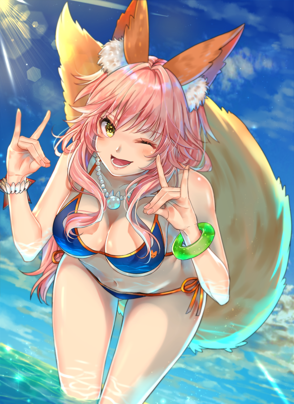 1girl ;d animal_ears azaka_(rionrita) bikini blue_bikini bracelet breasts fate/grand_order fate_(series) fox_ears fox_tail hanging_breasts highres jewelry leaning_forward long_hair looking_at_viewer medium_breasts navel one_eye_closed open_mouth pink_hair shiny shiny_skin smile solo swimsuit tail tamamo_(fate)_(all) tamamo_no_mae_(fate) water yellow_eyes