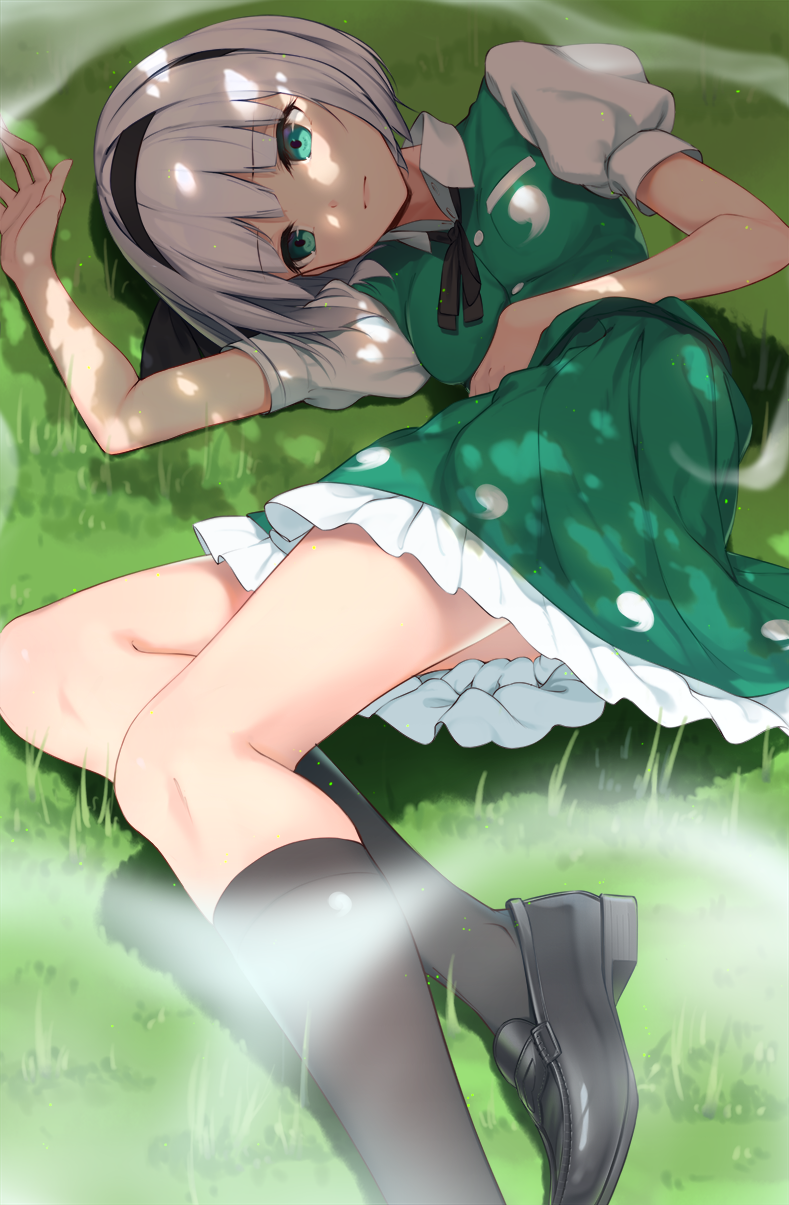 1girl black_footwear black_hairband black_legwear collared_shirt dappled_sunlight grass green_eyes green_skirt green_vest hair_ribbon hairband highres hitodama kneehighs konpaku_youmu konpaku_youmu_(ghost) loafers looking_at_viewer lying omochi_(youmu46) on_side petticoat puffy_sleeves ribbon shirt shoes short_hair short_sleeves silver_hair skirt skirt_set solo sunlight touhou vest