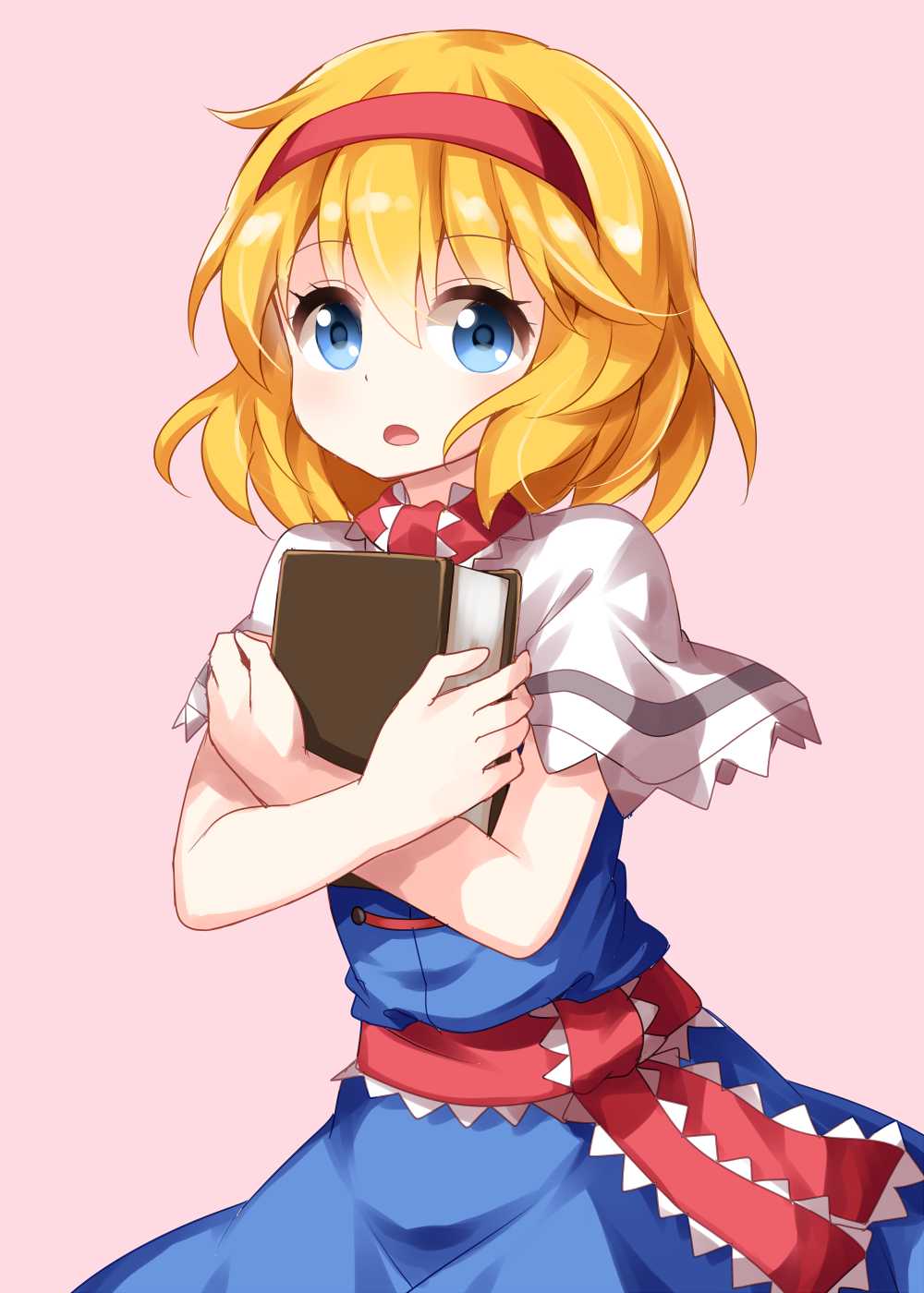 1girl alice_margatroid bangs blonde_hair blue_dress blue_eyes blush book capelet commentary_request cowboy_shot dress eyebrows_visible_through_hair hairband highres holding holding_book looking_at_viewer object_hug open_mouth pink_background red_hairband red_neckwear red_sash ruu_(tksymkw) sash short_hair simple_background solo standing touhou white_capelet