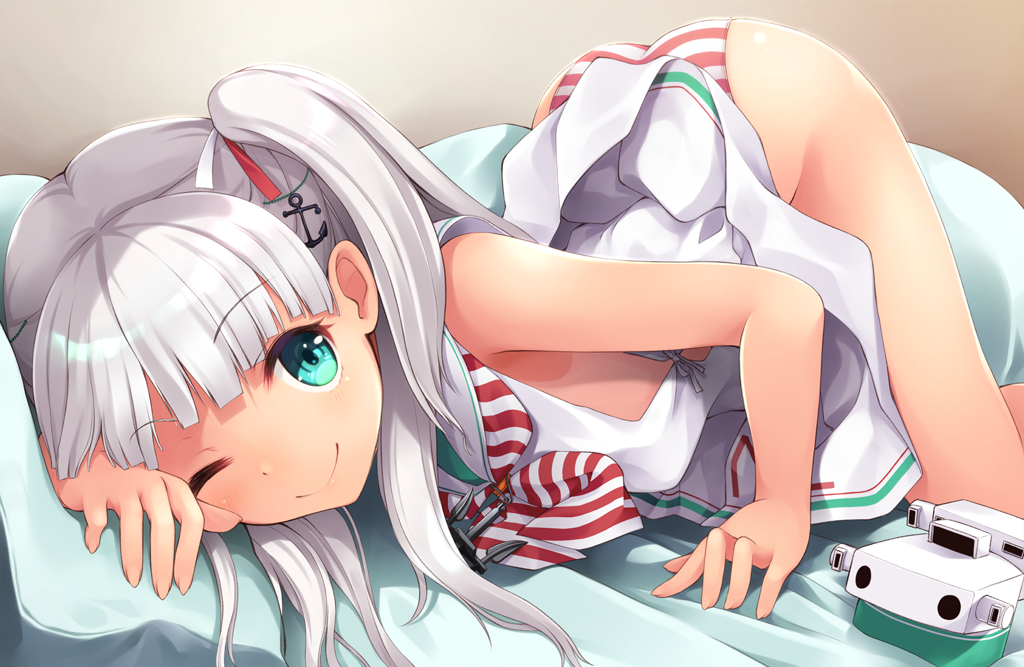 1girl anchor_hair_ornament ass bangs bed_sheet blush dress eyebrows_visible_through_hair green_eyes hair_ornament hair_ribbon kantai_collection long_hair looking_at_viewer maestrale_(kantai_collection) mofu_namako one_eye_closed one_side_up open_mouth panties pillow ribbon sailor_collar sailor_dress sidelocks silver_hair sleeveless sleeveless_dress smile solo striped striped_neckwear striped_panties tan thighs top-down_bottom-up underwear white_dress