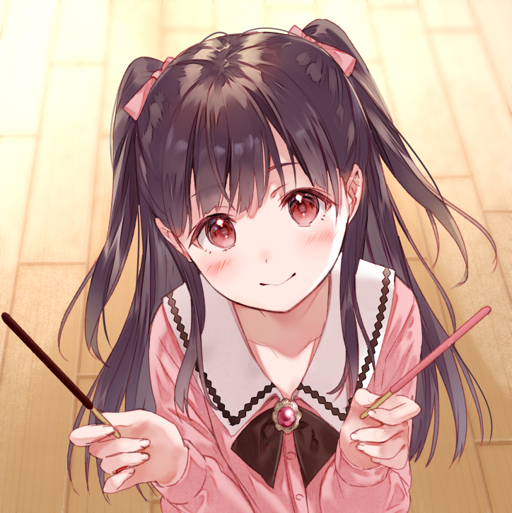 1girl black_bow blush bow bowtie brown_hair collarbone fukahire_(ruinon) hair_bow head_tilt holding long_hair looking_at_viewer original pink_bow pink_cardigan pocky_day red_eyes sailor_collar smile solo twintails upper_body white_sailor_collar wooden_floor