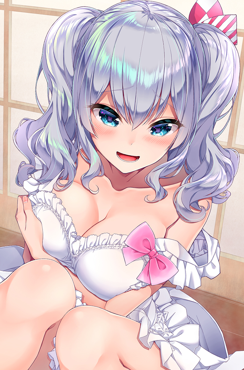 1girl blue_eyes blush breasts cleavage collarbone commentary_request dress eyebrows_visible_through_hair hair_between_eyes hakui_ami heart highres kantai_collection kashima_(kantai_collection) large_breasts looking_at_viewer open_mouth ribbon sidelocks silver_hair simple_background smile solo twintails wavy_hair white_background white_dress