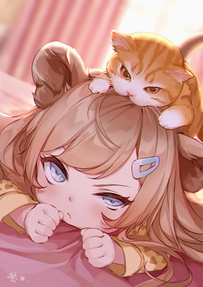 1girl animal animal_ears animal_on_head bangs bed_sheet blurry blurry_background brown_shirt cat cat_on_head commentary_request day depth_of_field dutch_angle hair_ornament hairclip heart heart_print light_brown_hair lion_ears long_hair long_sleeves looking_at_viewer lying maou_renjishi on_head on_stomach original print_shirt shirt solo sunlight v-shaped_eyebrows window