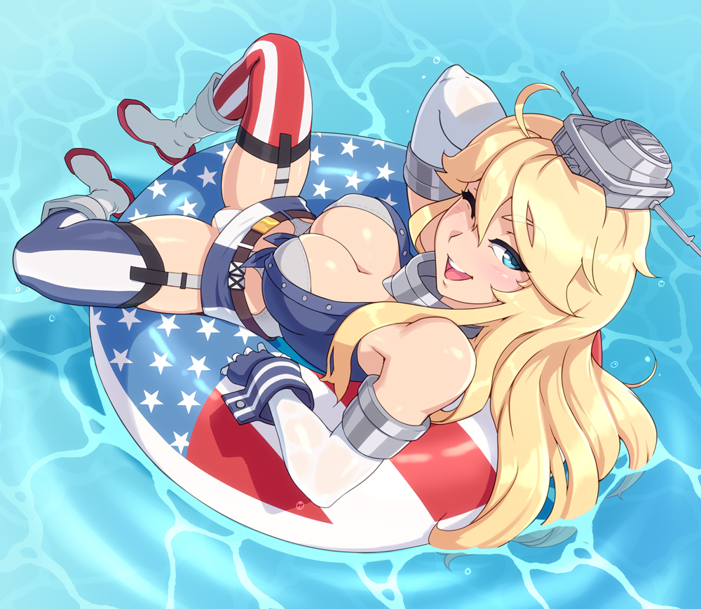 1girl american_flag american_flag_legwear blonde_hair blue_eyes blush breasts cleavage commentary elbow_gloves english_commentary eyebrows_visible_through_hair front-tie_top garter_straps gloves hair_between_eyes headgear innertube iowa_(kantai_collection) kantai_collection large_breasts looking_at_viewer mismatched_legwear one_eye_closed owler piercing smile solo striped thigh-highs vertical_stripes water