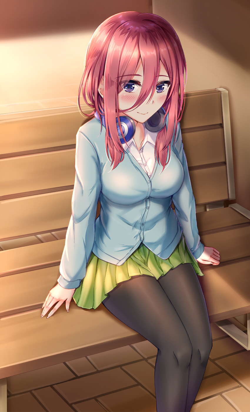 1girl bangs bench black_legwear blue_cardigan blue_eyes blush breasts brown_hair cardigan closed_mouth collarbone eyebrows_visible_through_hair feet_out_of_frame fingernails go-toubun_no_hanayome hair_between_eyes headphones headphones_around_neck highres large_breasts long_sleeves looking_at_viewer medium_hair muwa12 nakano_miku pantyhose shirt sitting skirt solo white_shirt