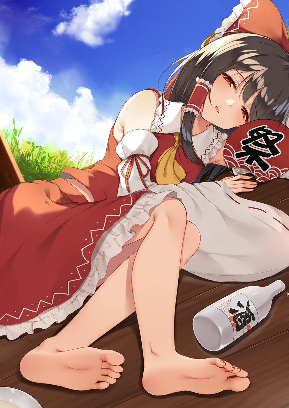 1girl alcohol arm_ribbon ascot bangs bare_shoulders barefoot black_hair blue_sky bottle bow clouds commentary day detached_sleeves eyebrows_visible_through_hair fan feet flan_(seeyouflan) frilled_bow frilled_shirt_collar frills grass hair_bow hair_tubes hakurei_reimu half-closed_eyes highres holding holding_fan long_hair looking_at_viewer lying on_side outdoors paper_fan parted_lips petticoat red_bow red_eyes red_ribbon red_skirt ribbon ribbon-trimmed_sleeves ribbon_trim sake sake_bottle sidelocks skirt skirt_set sky soles solo touhou translated uchiwa wooden_floor yellow_neckwear