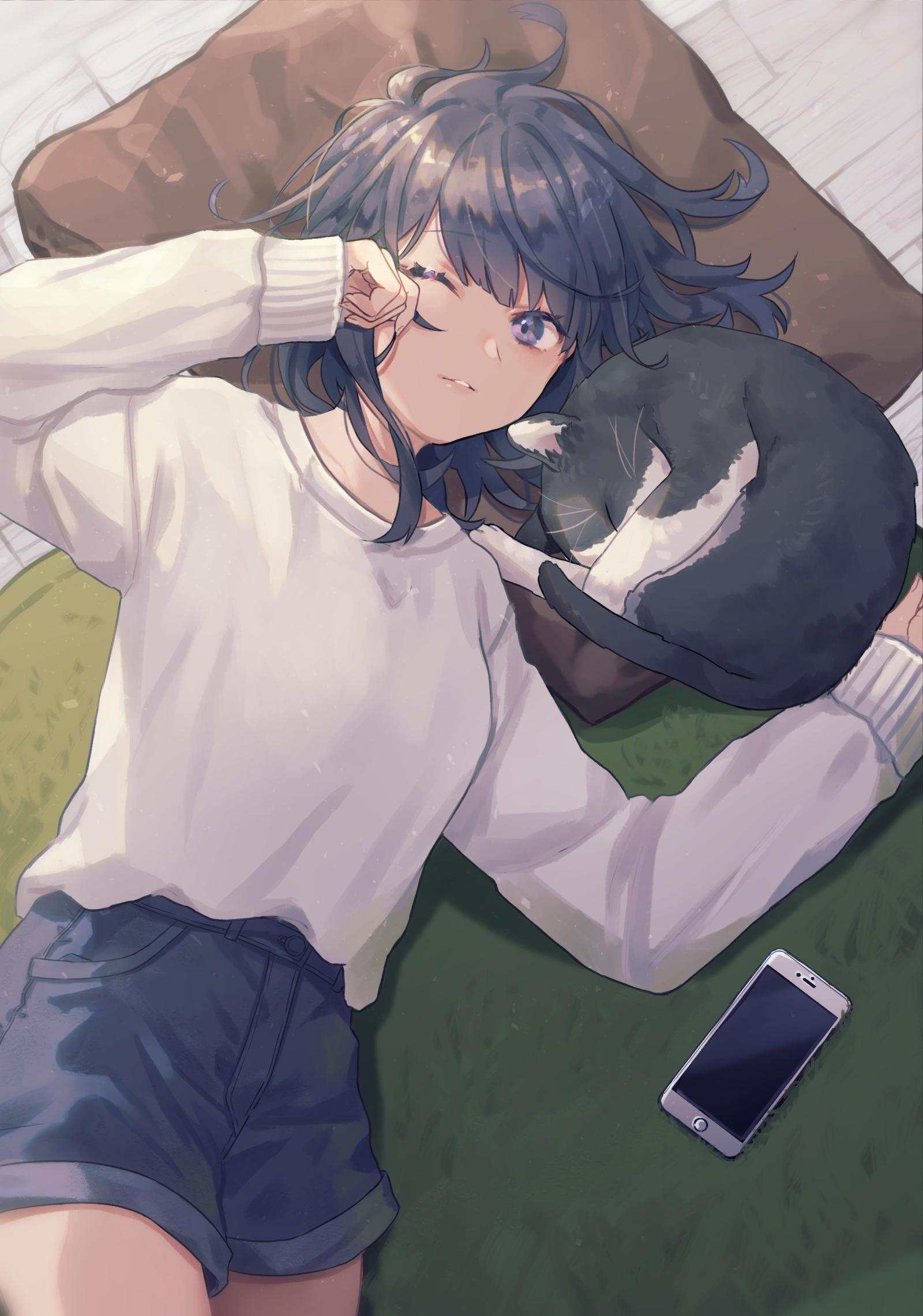 1girl black_hair blue_eyes cat cellphone closed_mouth denim denim_shorts eyebrows_visible_through_hair highres iphone long_sleeves looking_at_viewer lying on_back one_eye_closed original phone pillow saino short_hair shorts sleeves_past_wrists smartphone smile solo sweater white_sweater
