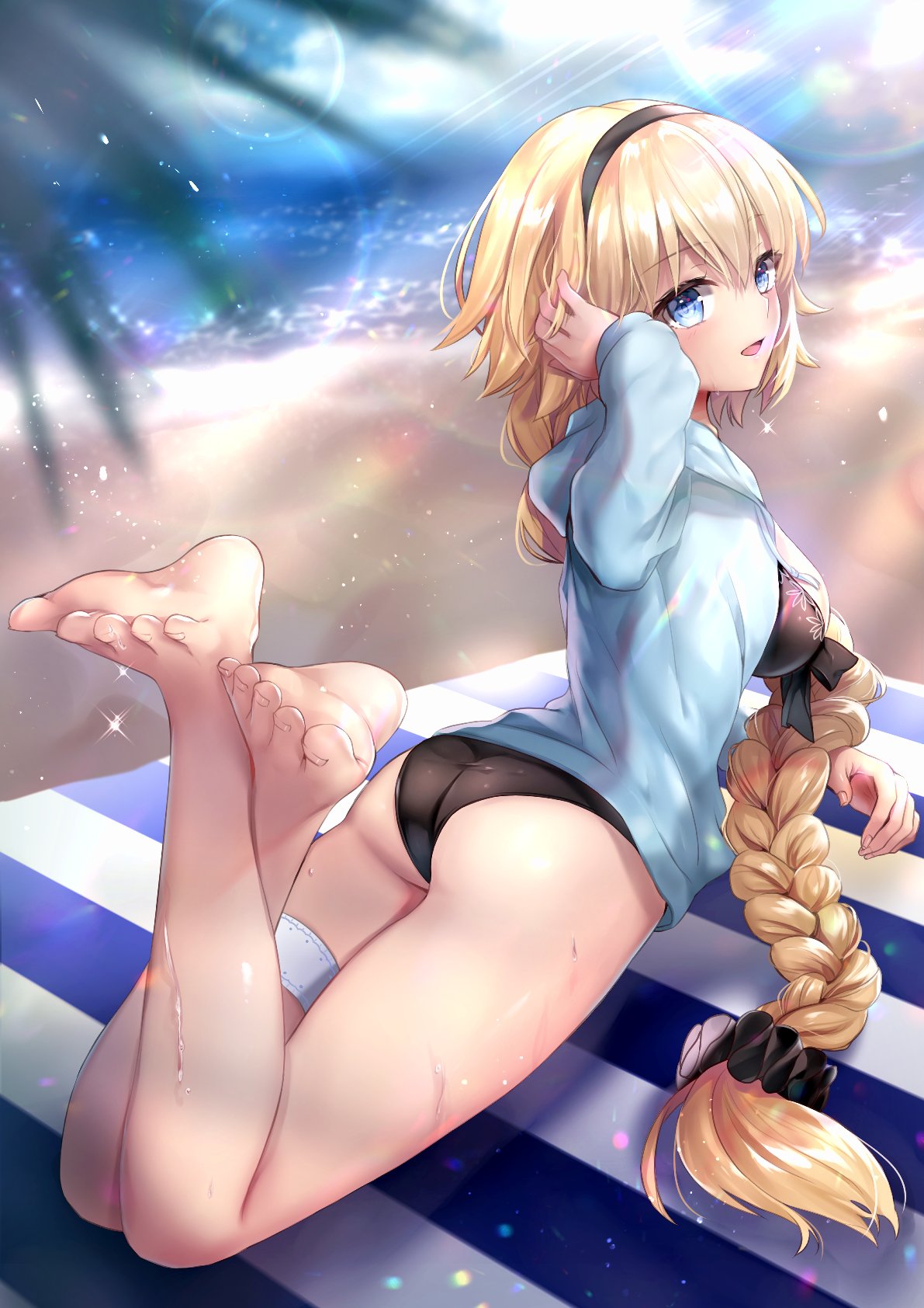 1girl ass barefoot beach beach_towel blonde_hair blue_eyes blurry blurry_background blurry_foreground braid eyebrows_visible_through_hair fate/grand_order fate_(series) hairband hane_yuki highres hood hoodie jacket jeanne_d'arc_(fate)_(all) jeanne_d'arc_(swimsuit_archer) lens_flare light_particles lying on_stomach open_clothes open_jacket open_mouth palm_leaf sand single_braid solo sparkle striped_towel thigh_strap towel