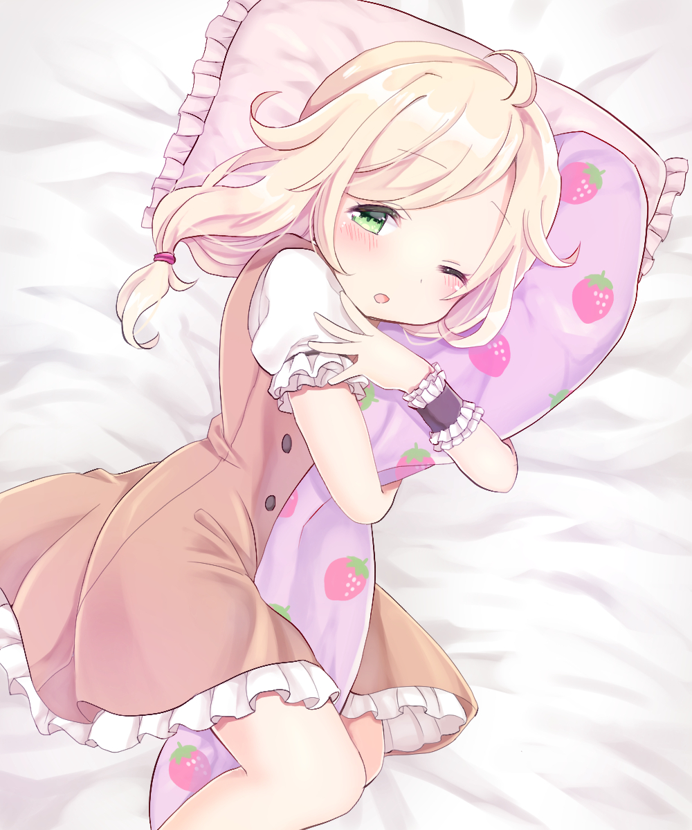 1girl :o ahoge amaimo bangs bed blonde_hair blush body_pillow brown_dress buttons dot_nose dress eyebrows_visible_through_hair food_print frilled_cuffs frilled_dress frilled_sleeves frills green_eyes hand_on_own_shoulder highres hug idolmaster idolmaster_cinderella_girls leg_hug long_hair low-tied_long_hair lying medium_hair messy_hair object_hug on_bed on_side one_eye_closed open_mouth pillow pinafore_dress puffy_short_sleeves puffy_sleeves short_sleeves solo strawberry_print swept_bangs tareme tears wavy_hair white_dress wrist_cuffs yusa_kozue