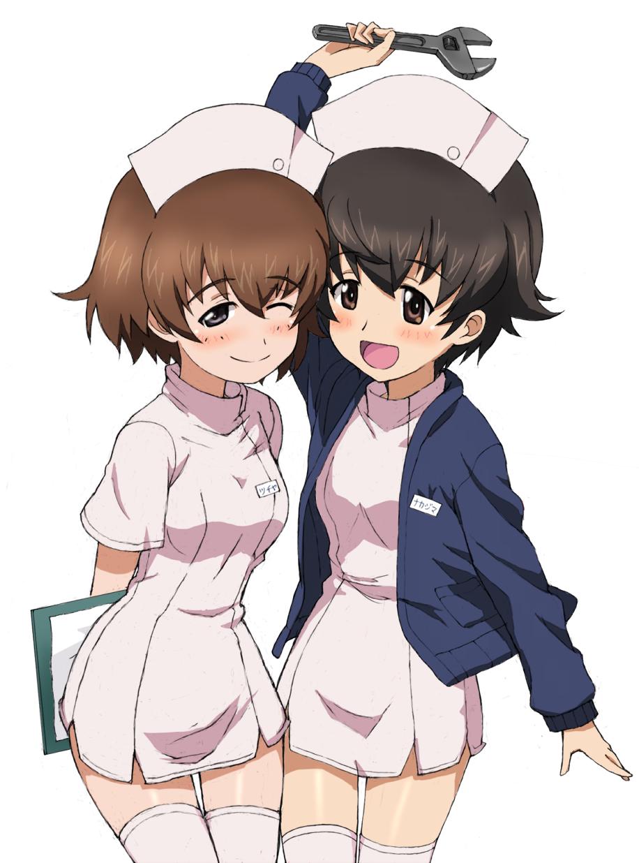 2girls :d ;) alternate_costume arm_up arms_behind_back bangs blue_jacket blush brown_eyes brown_hair clipboard closed_mouth commentary cowboy_shot dress eyebrows_visible_through_hair freckles girls_und_panzer half-closed_eye hat highres holding holding_clipboard holding_wrench jacket kayabakoro leaning_forward long_sleeves looking_at_viewer multiple_girls nakajima_(girls_und_panzer) name_tag nurse_cap object_behind_back one_eye_closed open_mouth pink_dress pink_headwear pink_legwear short_dress short_hair simple_background smile thigh-highs translated tsuchiya_(girls_und_panzer) white_background
