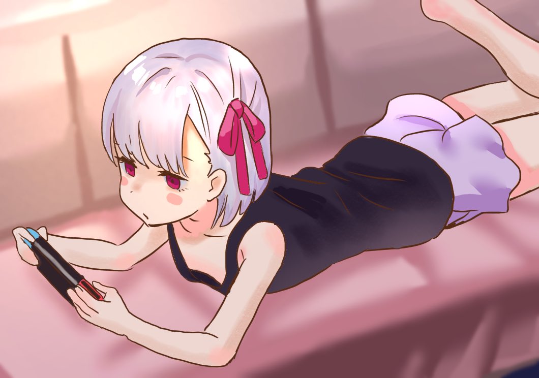 1girl bangs bare_arms black_shirt blush_stickers couch fate/grand_order fate_(series) hair_ornament hair_ribbon jitome kama_(fate/grand_order) leg_up lying nintendo_switch on_couch on_stomach pink_eyes playing_games purple_shorts ribbon shirt short_hair shorts simple_background white_hair zenshin