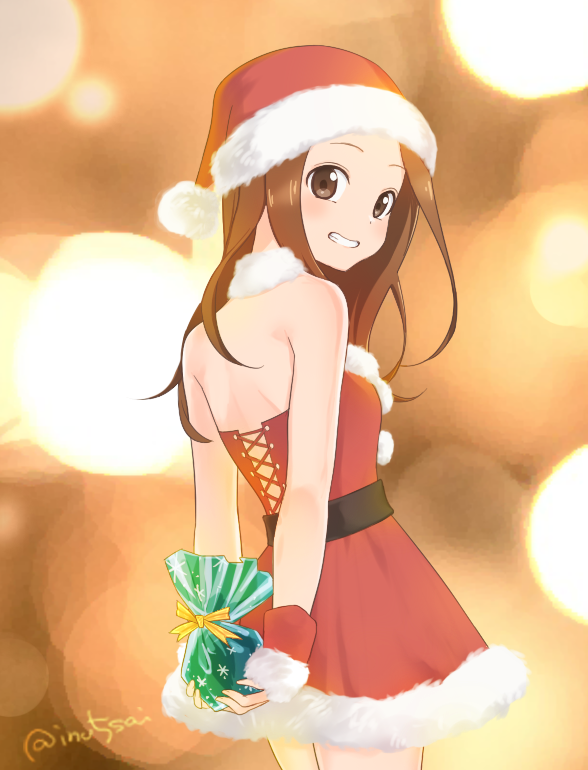 1girl backless_dress backless_outfit bangs bare_shoulders blurry blurry_background blush brown_eyes brown_hair christmas commentary_request cowboy_shot detached_collar dress forehead from_behind fur_trim gift hat holding holding_gift karakai_jouzu_no_takagi-san light long_hair looking_at_viewer looking_back parted_bangs red_dress santa_costume santa_hat sidelocks smile solo takagi-san twitter_username tytj5222
