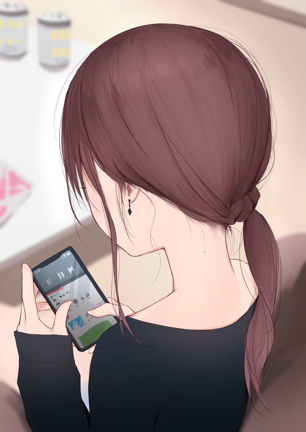 1girl black_shirt blurry blurry_background brown_hair can cellphone commentary_request depth_of_field earrings facing_away highres holding holding_cellphone holding_phone indoors jewelry kanju long_hair long_sleeves mole mole_on_neck nape neck original phone ponytail shirt sitting sleeves_past_wrists solo table upper_body