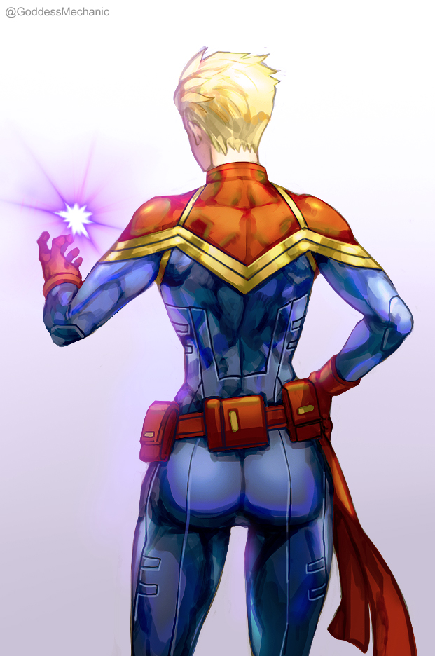 1girl ass blonde_hair bodysuit captain_marvel carol_danvers from_behind gloves hand_on_hip kim_yura_(goddess_mechanic) marvel pouch red_gloves short_hair solo superhero twitter_username very_short_hair