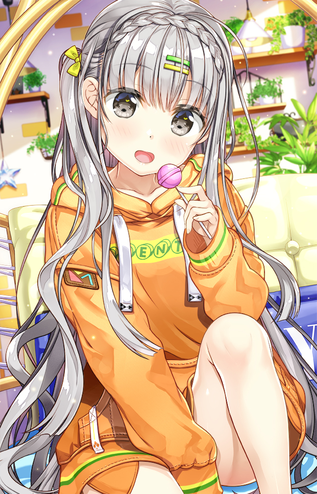 1girl :d bangs blurry blurry_background blush bow braid candy clothes_writing collarbone commentary_request crown_braid depth_of_field eyebrows_visible_through_hair food fujima_takuya grey_eyes grey_hair hair_bow hair_ornament hairclip holding holding_food holding_lollipop hood hood_down hoodie indoors knee_up lollipop long_hair long_sleeves looking_at_viewer one_side_up open_mouth orange_hoodie original plant potted_plant sitting sleeves_past_wrists smile solo star very_long_hair yellow_bow