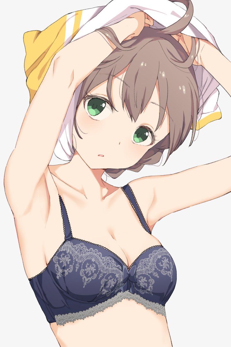 1girl ahoge armpits arms_up bangs bare_shoulders blue_bra blush bra braid breasts brown_hair green_eyes grey_background highres hiroki_(yyqw7151) idolmaster idolmaster_million_live! idolmaster_million_live!_theater_days looking_at_viewer medium_breasts midriff open_mouth sakuramori_kaori shirt short_hair simple_background solo t-shirt tied_hair underwear undressing upper_body