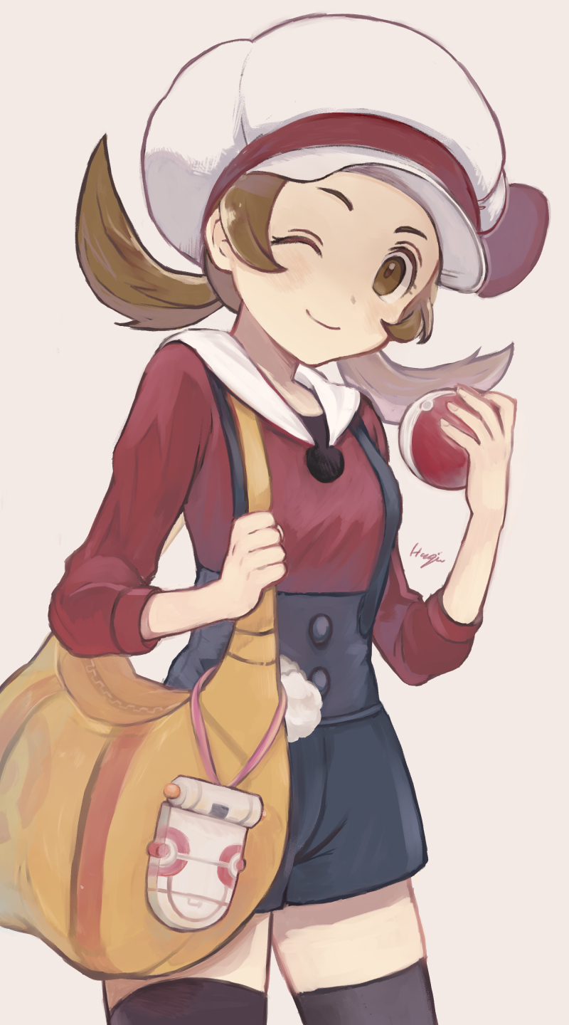 1girl bag black_legwear blue_overalls blush brown_eyes brown_hair closed_mouth commentary cowboy_shot eyelashes hagi_machico hat hat_ribbon highres holding holding_poke_ball holding_strap kotone_(pokemon) looking_at_viewer one_eye_closed overalls poke_ball poke_ball_(basic) pokegear pokemon pokemon_(game) pokemon_hgss ribbon smile solo thigh-highs twintails white_background white_headwear